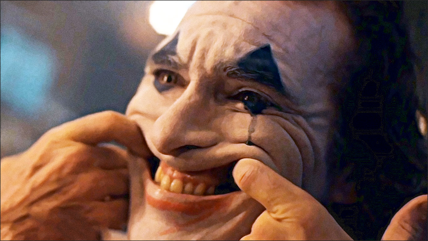 joker se force a rire